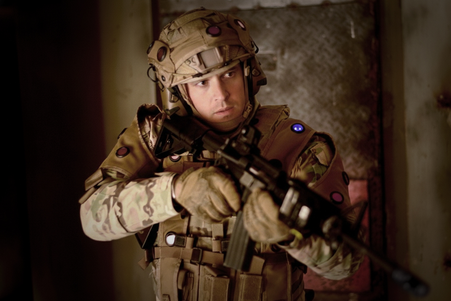 Soldier wearing ORION LETS vest and helmet sensors during training